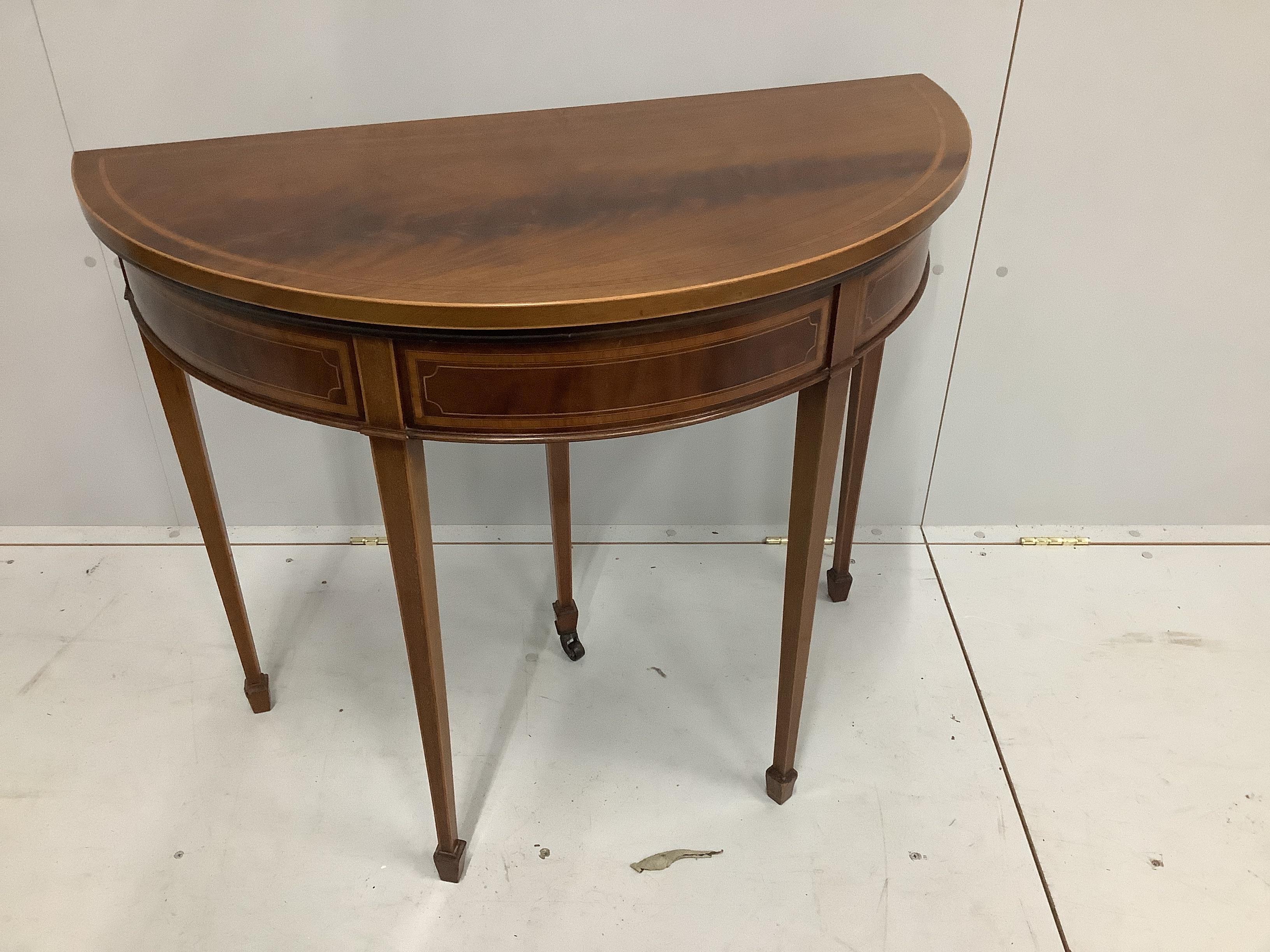 An Edwardian satinwood banded mahogany D shaped folding card table, width 91cm, depth 45cm, height 77cm